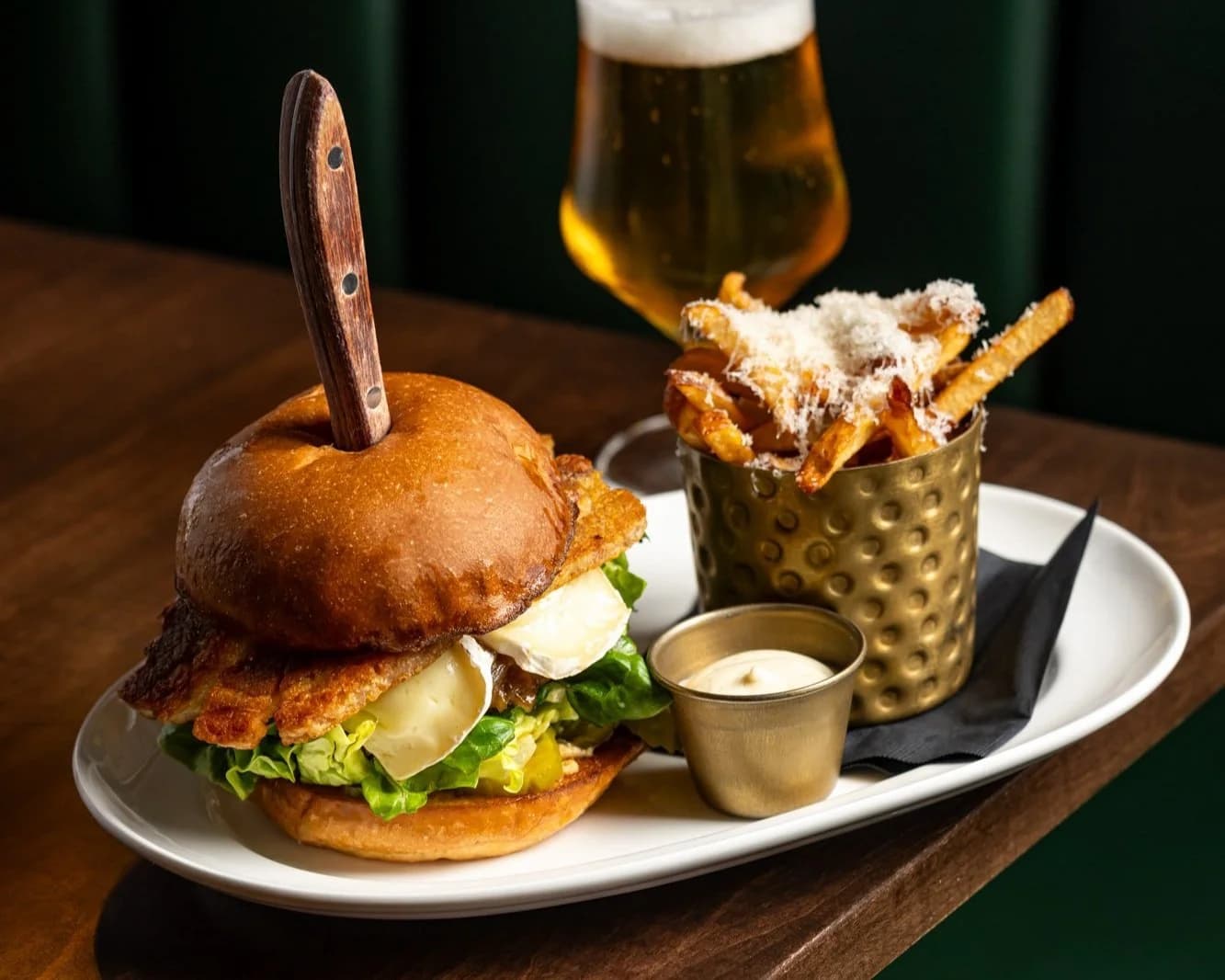 $25 Burger & A Beer special — Berczy Burger and lager at the bar