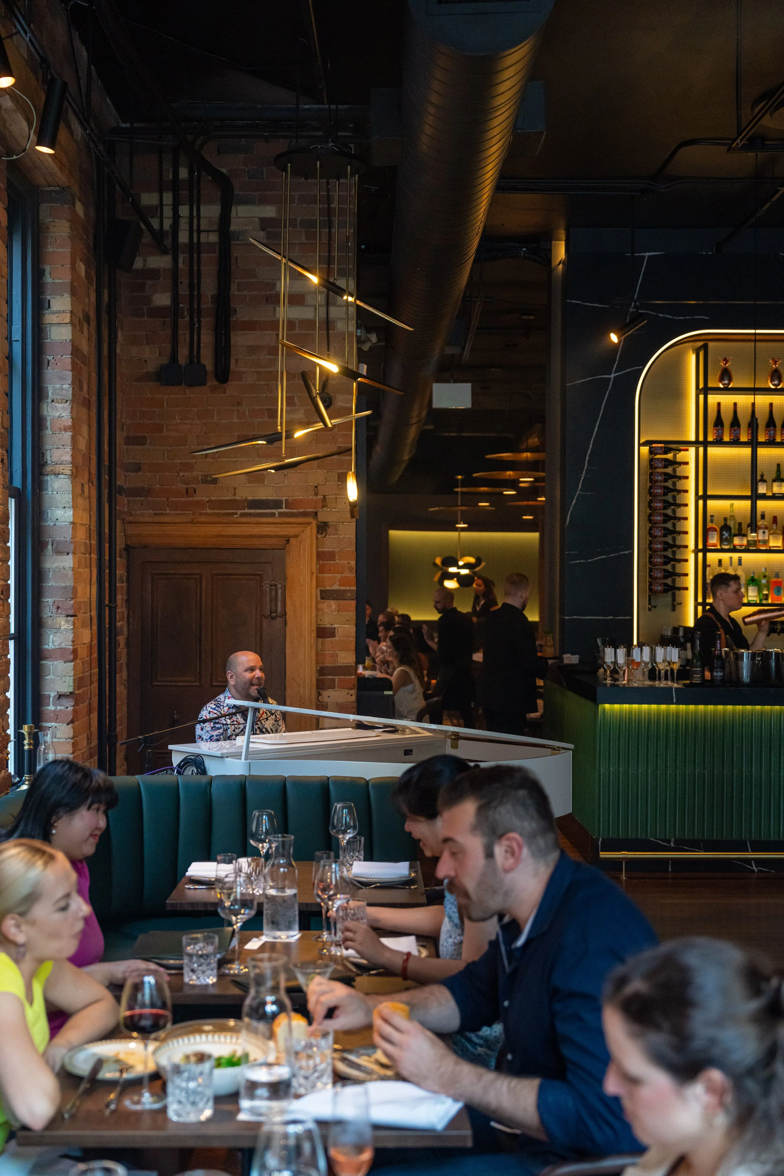 A pianist performing live at The Berczy Tavern